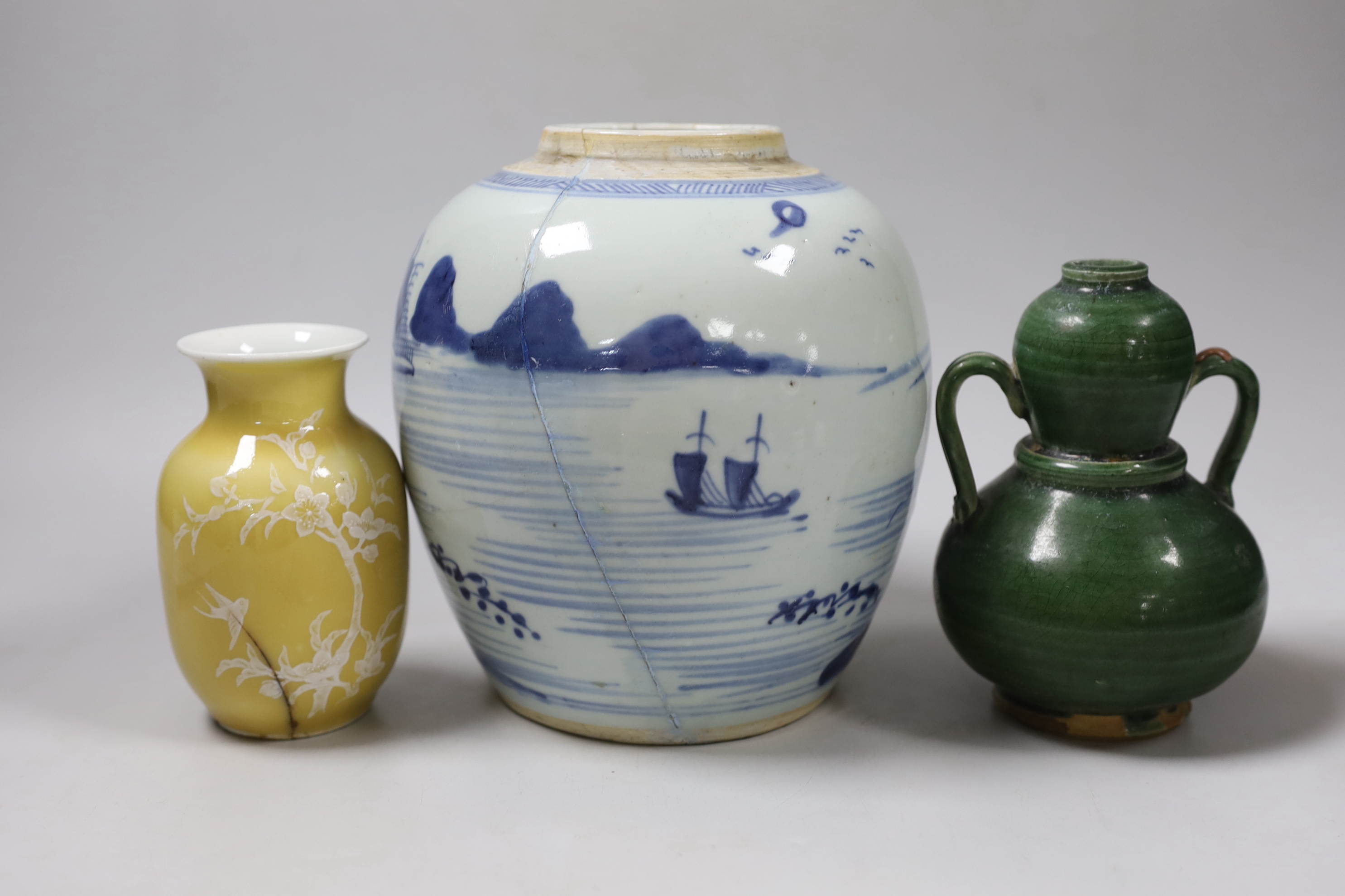 A Chinese blue and white vase, together with a Chinese green two handled double gourd vase and another, tallest 19cm